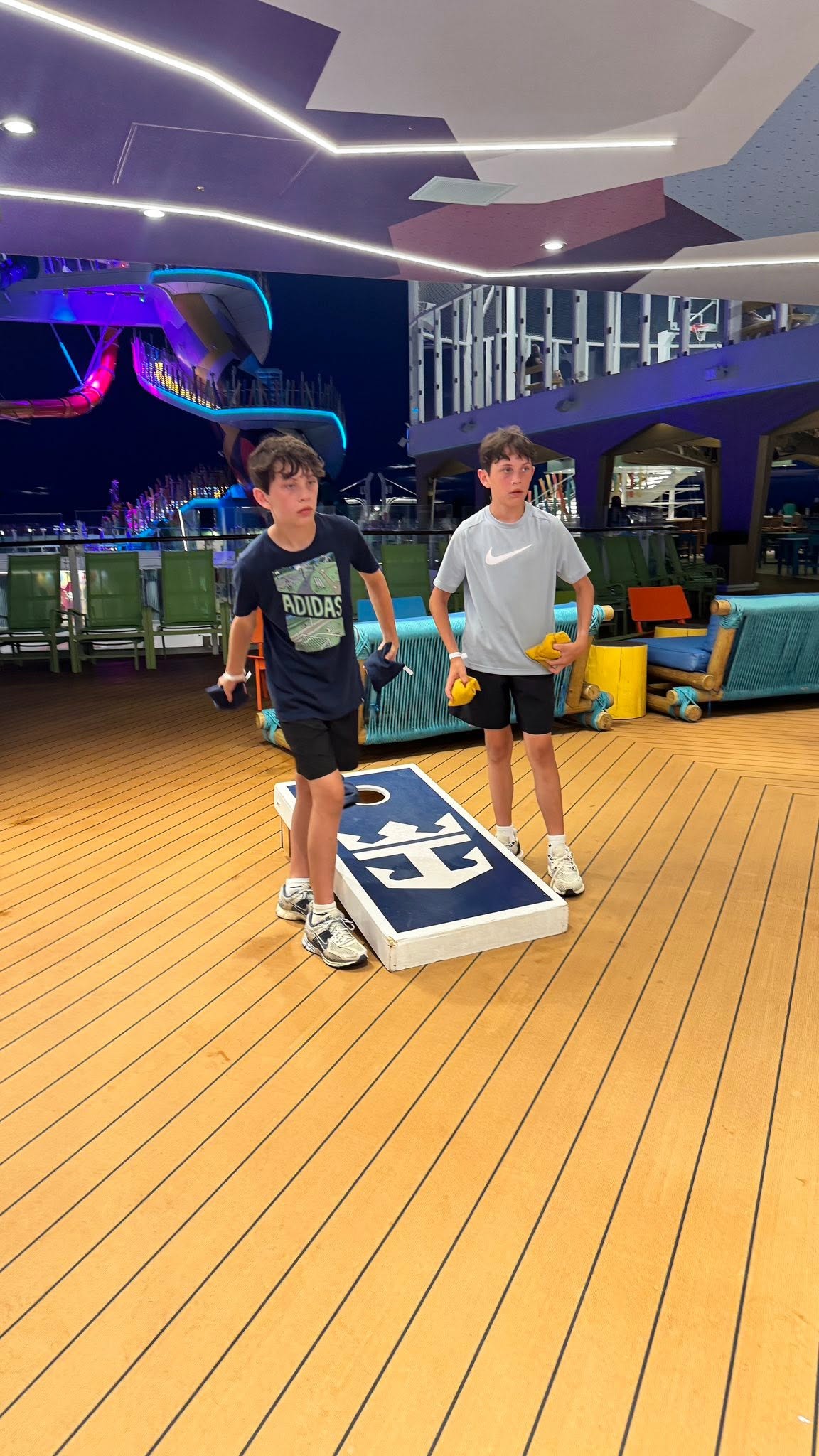 Boys playing cornhole on Star of the Seas