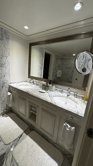 Closet and full bath in our Fairmont Orchid suite