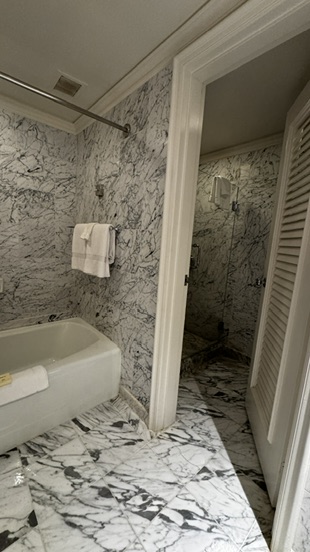 Closet and full bath in our Fairmont Orchid suite