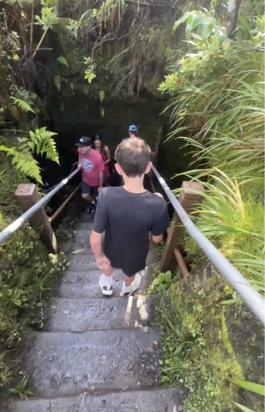 Climbing into a lava tube on the Big Island