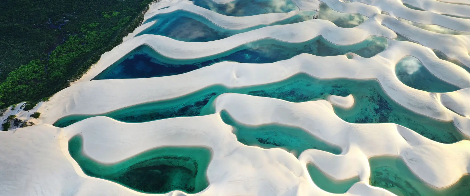 Turquoise lagoons among the white sand dunes of Lencois Maranhenses National Park in Brazil