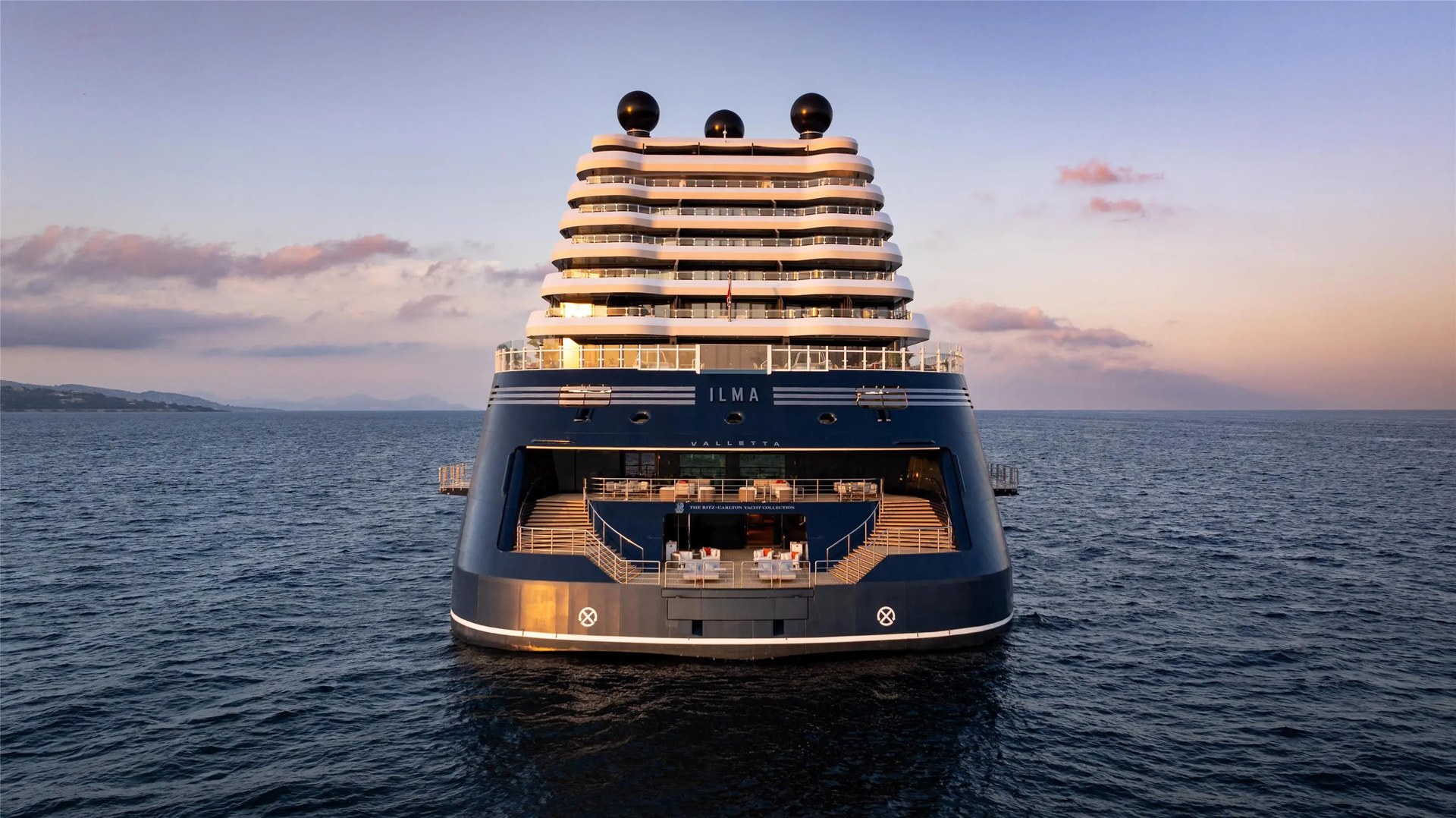 Ilma yacht viewed from the stern at sunset